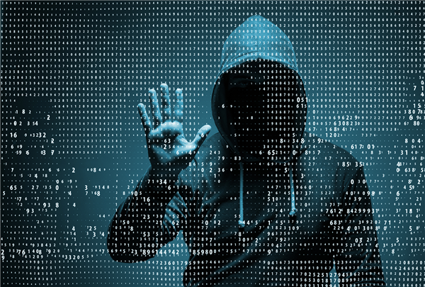 Man in a hooded sweater engaged in cyber security